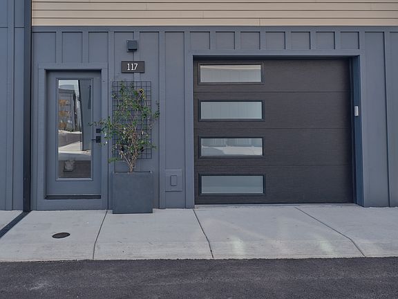 Entry and garage of a similar unit, exterior keypad garage entry, remote entry, heated garage with door from inside garage to inside home,smart garage door opener will automatically close at set amount of minutes ,also a camera to check on your phone