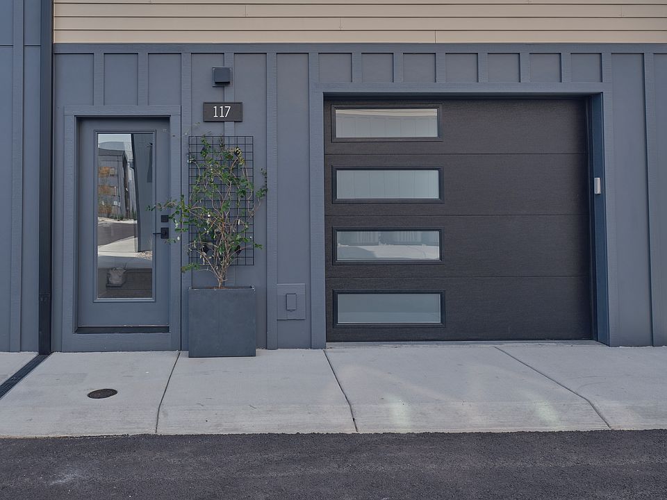 Entry and garage of a similar unit, exterior keypad garage entry, remote entry, heated garage with door from inside garage to inside home,smart garage door opener will automatically close at set amount of minutes ,also a camera to check on your phone