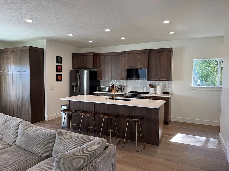 Kitchen with large island and bar stool seating
