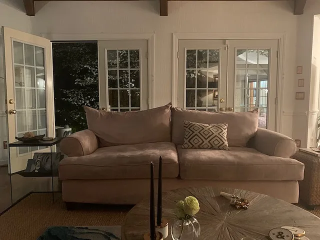 Night view of tv room/den with french doors