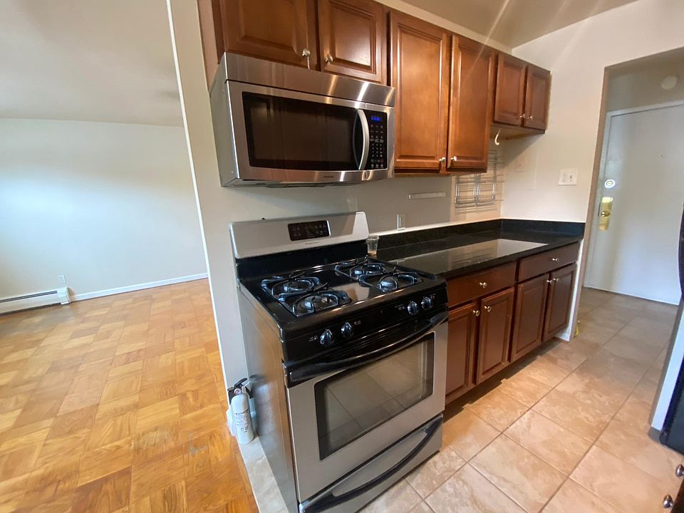 Kitchen with gas stove, dishwasher, microwave and disposal.