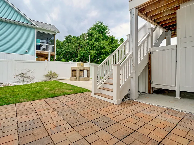 Side patio and back steps of house