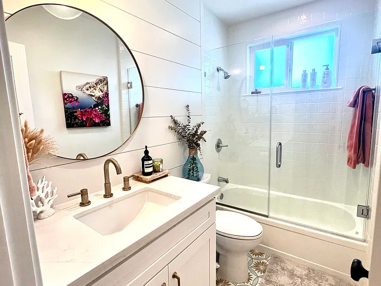 Guest Bathroom: Stylish guest bathroom with Spanish tile floors, premium filtered showerhead, and excellent water pressure