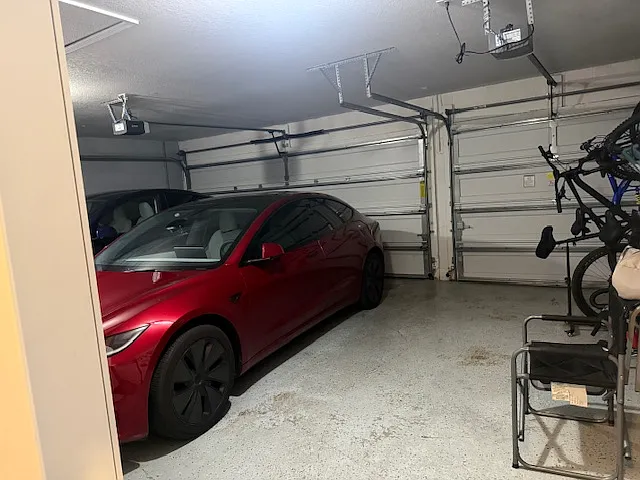 Spacious 3-car garage with additional storage space.