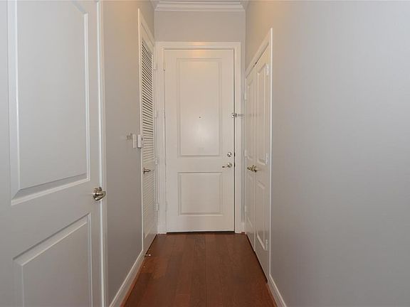 This home has a private hall entry.  There is coat closet and a powder room in this entry hall.