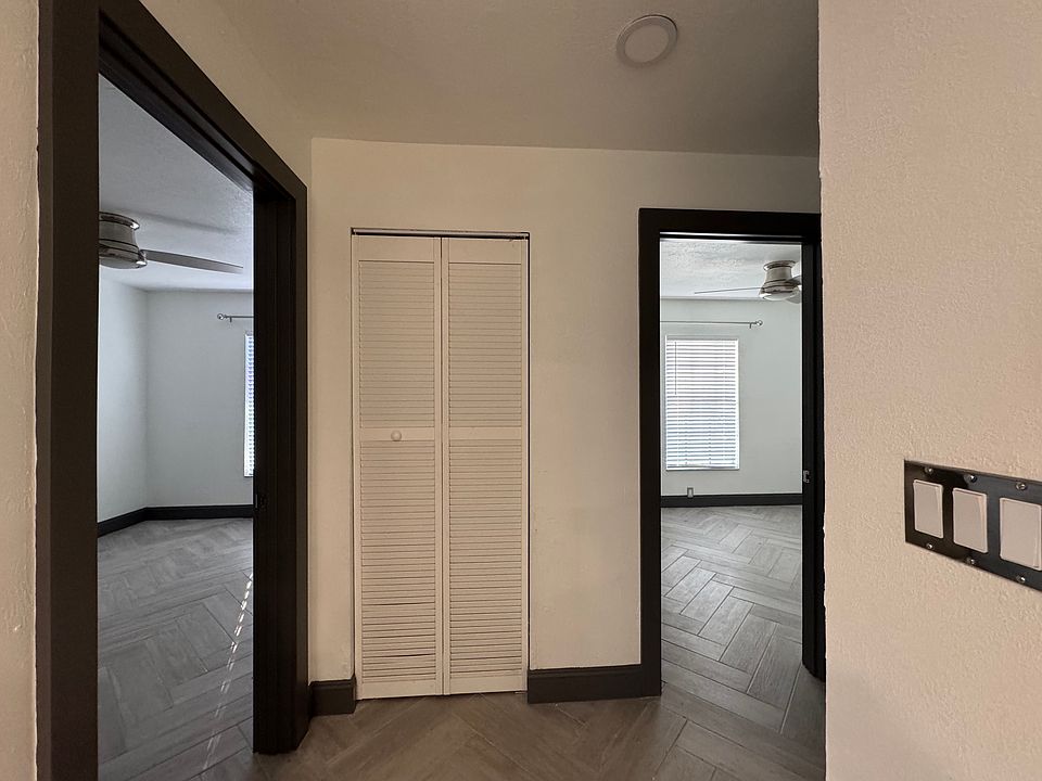 Hallway with the view of the doorway to each of the two bedrooms...front bedroom to the left