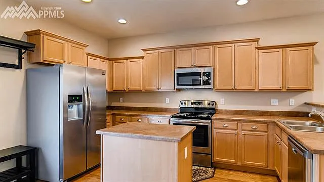 Kitchen with all stainless steel appliances