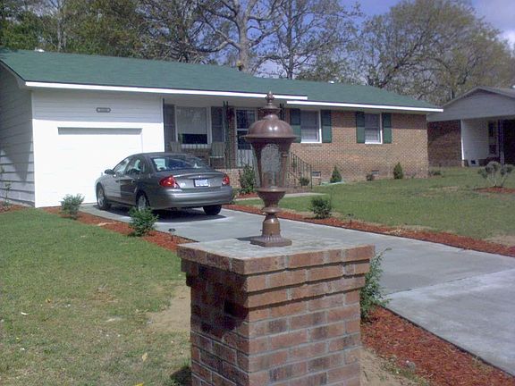 Pillar Lights enhance the well landscaped property
