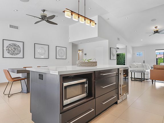 FROM KITCHEN TOWARD DINING AREA AND YOU CAN SEE THE GREAT ROOM TO THE RIGHT OF THIS PHOTO