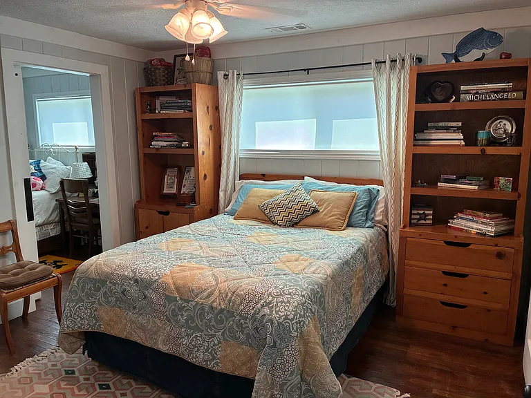 Bedroom 2 - Queen - shows barn door open to single bedroom
