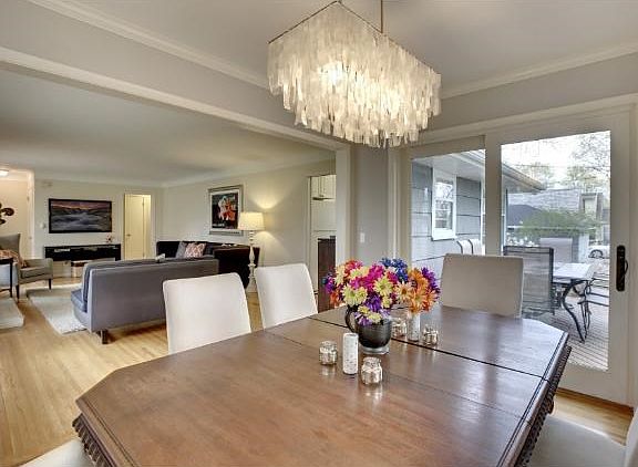 Dining room could also be a sunroom...3 walls of windows...a favorite room! Walks out to deck, grill and views of Golf Course.
