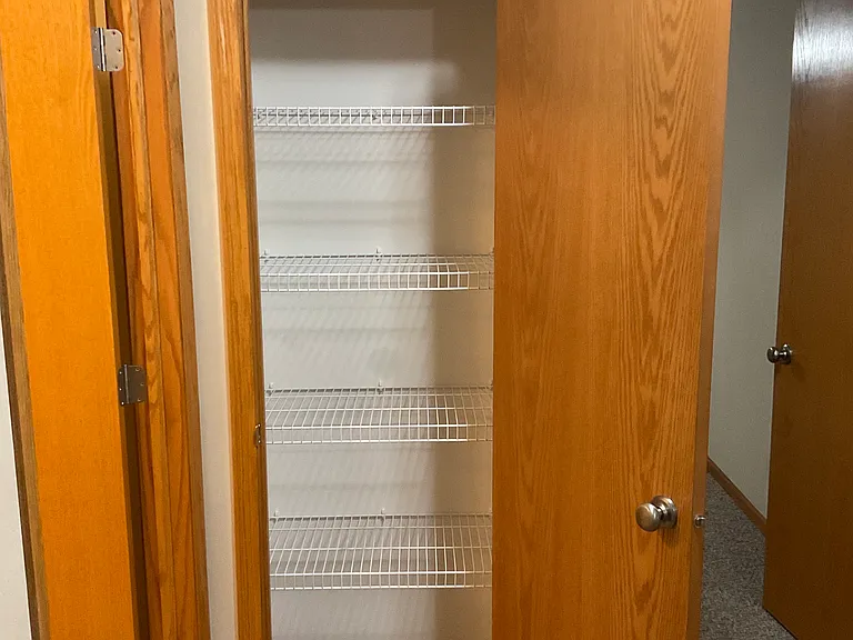 Huge closet outside bedrooms with built in storage