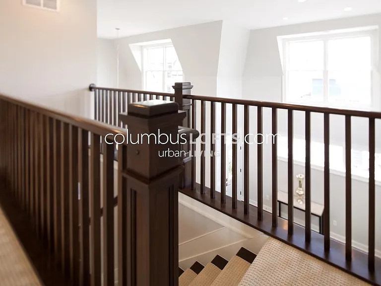 stairs to upper level, which has 2 more private bedrooms and one "Jack-and-Jill" full bathroom in between them.
