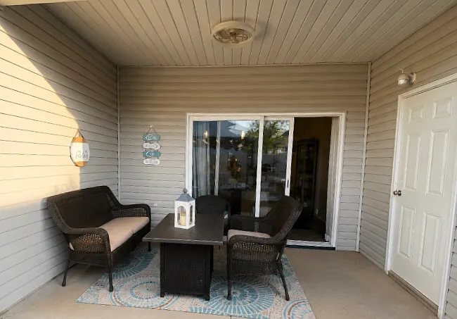 Covered Back Patio with Connected Storage Unit and Sealing Fan