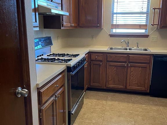 Kitchen looking in from garage, Pantry on left, stove and sink