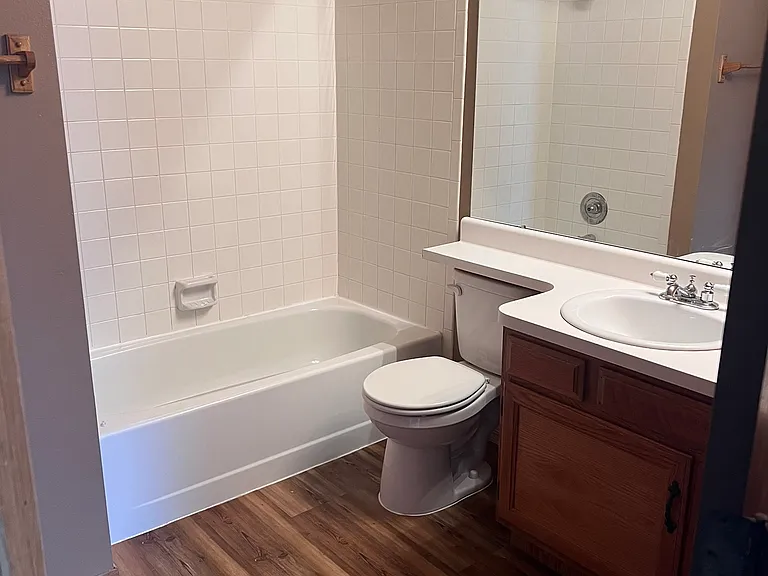 Upstairs bathroom with double sinks and full shower/bathtub.