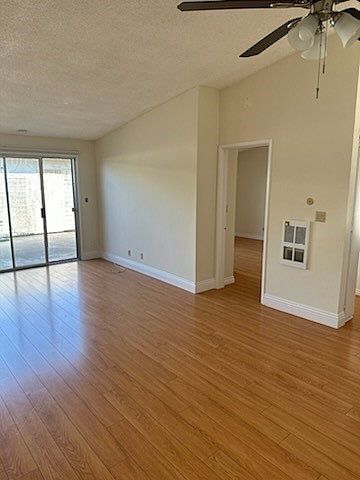 Living room with entrance to private patio