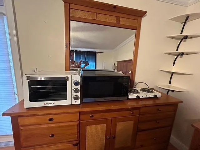 Has toaster oven, microwave, 2 burner stove so can cook anything