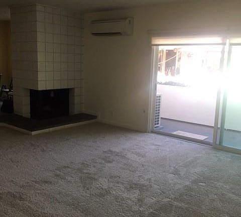 Living Room (view from corner). Extra-wide sliding door with screen window exiting to balcony.
