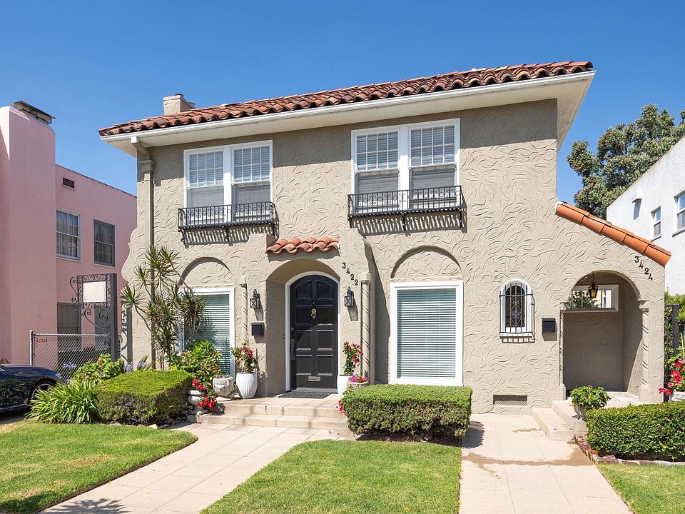 Front of property -(door to 3424 Park is on the right side of building under the archway)