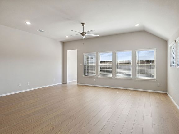 Living Room in the Diamond home plan by Trophy Signature Homes - REPRESENTATIVE PHOTO