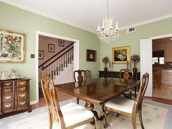 View of the dining room toward the entry hall and kitchen area.