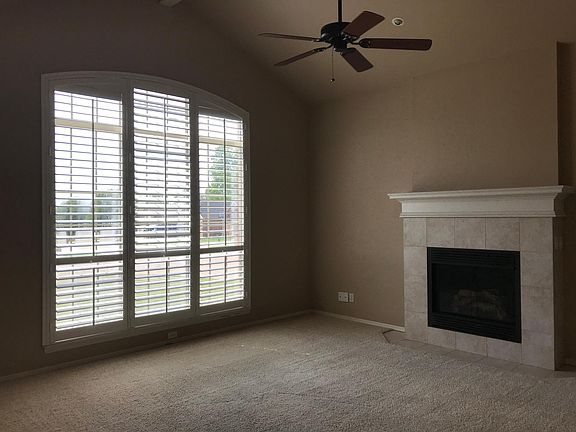 Living area looking northwest. Fireplace has gas insert.