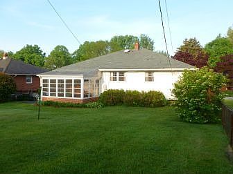 Spacious rear yard & enclosed porch