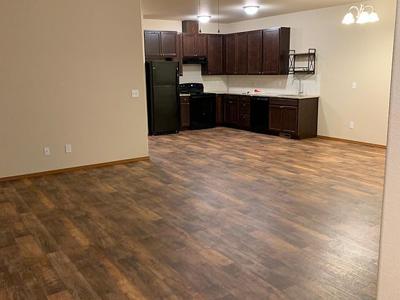 View from the Front door into open floor plan kitchen and living and dining area