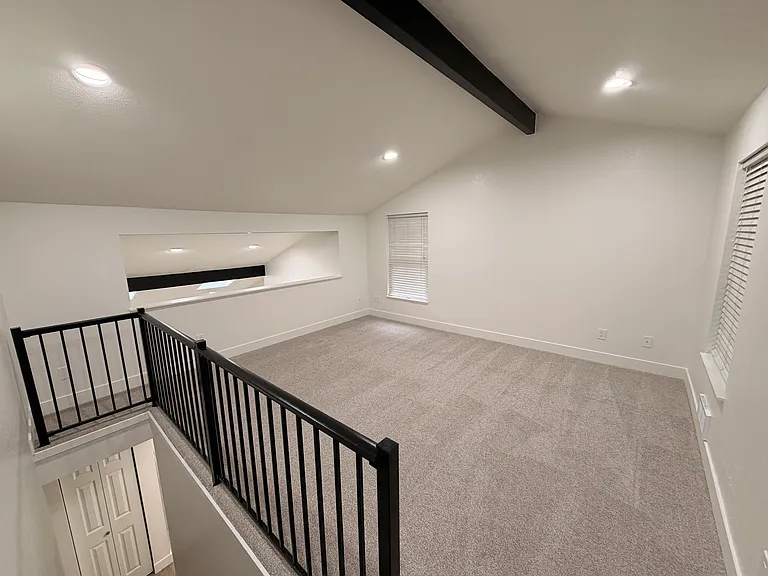 Loft style primary bedroom