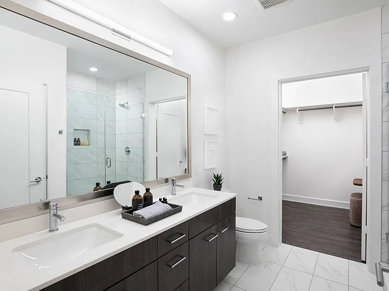 Spacious walk-in closets provide ample storage space.