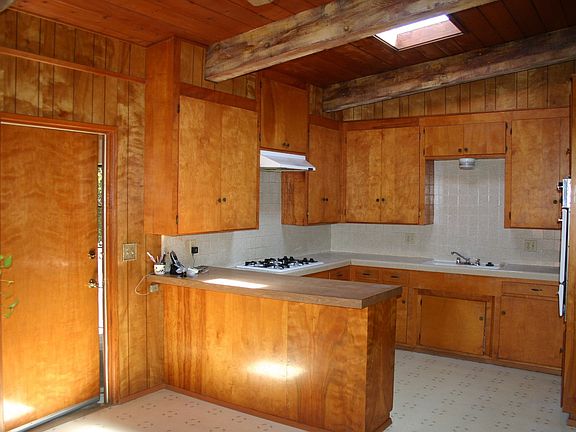 Solid wood cabinetry could be updated with paint and new hardware.