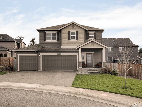 Stylish craftsman facade has appealing street presence and includes a 3 car garage.