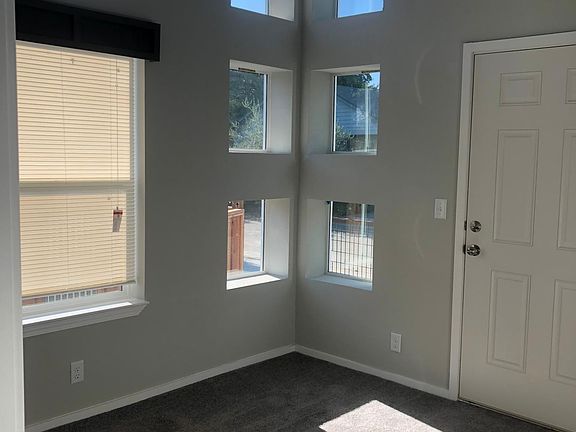 Bedroom 1 with door to small private outdoor area