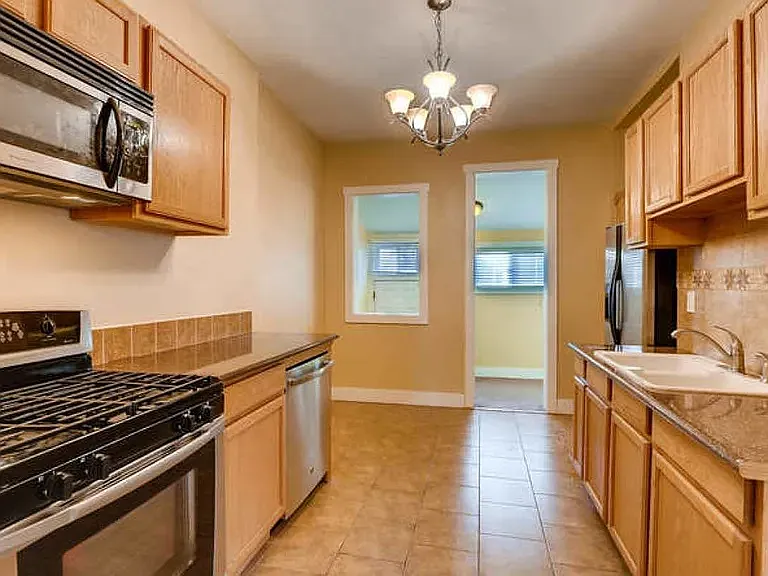 The kitchen has a gas range and an eating nook