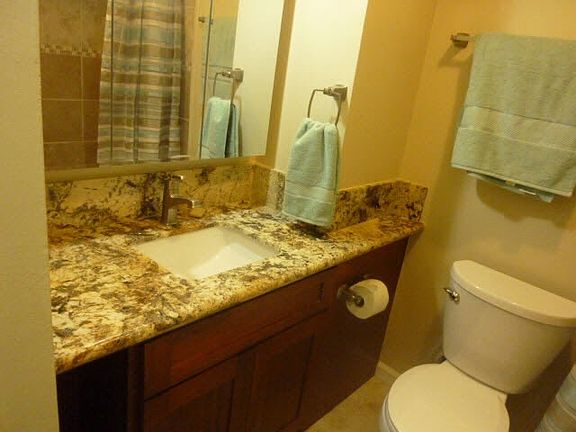 Granite Counter Tops over Cherry Wood and Brushed Nickel Fau