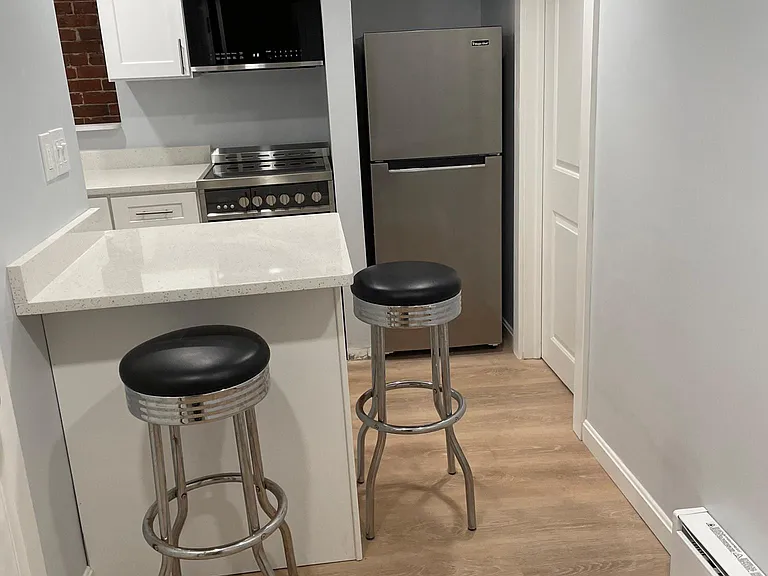 Island with Quartz countertops 
Stainless steel appliances including convection oven and over the range microwave