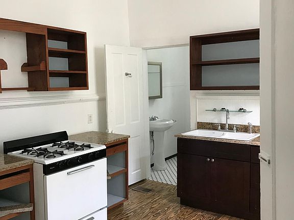 Kitchen and bathroom entry. New kitchen sink and cabinets.