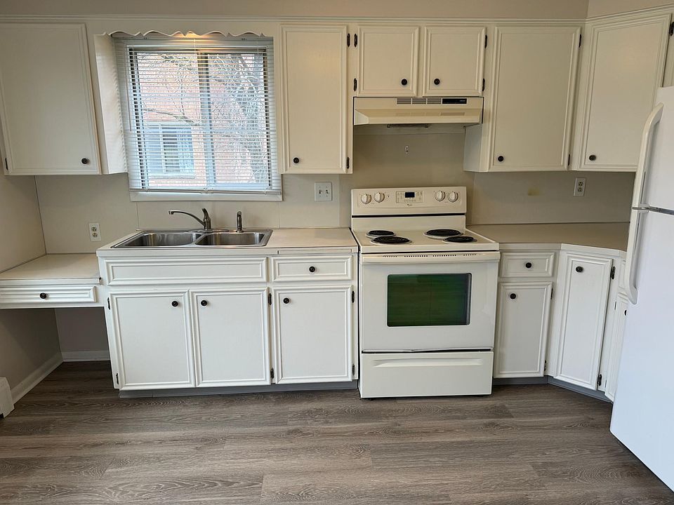Kitchen/dining area with new laminate wood floor.