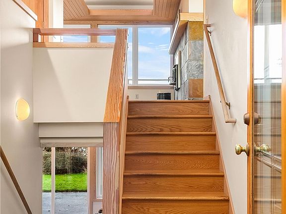Welcome to this lovely and elegant home! Oak hardwood steps lead up to the main floor with master suite; the half-bath is off the entry to the left of photo. Carpeted stairs lead down to the lower-level with second kitchen, great room, bath, laundry and two bedrooms.