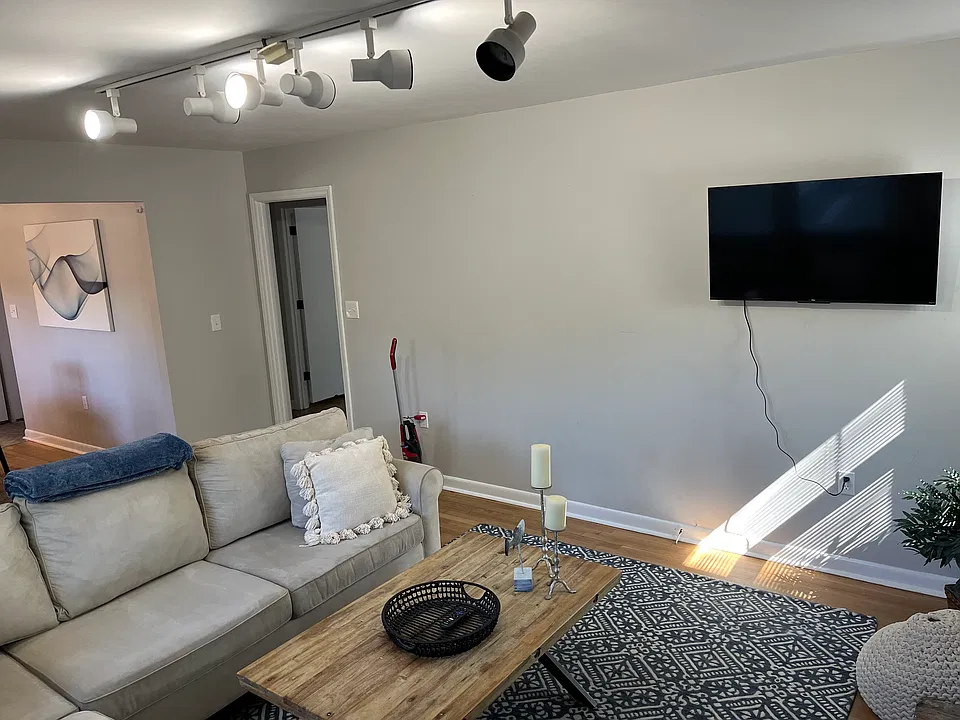 Spacious living room with hardwood floors and plenty of natural light.