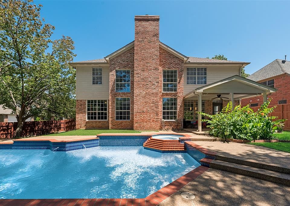 View of pool featuring a fenced backyard, a patio, ceiling fan, and a pool with connected hot tub
