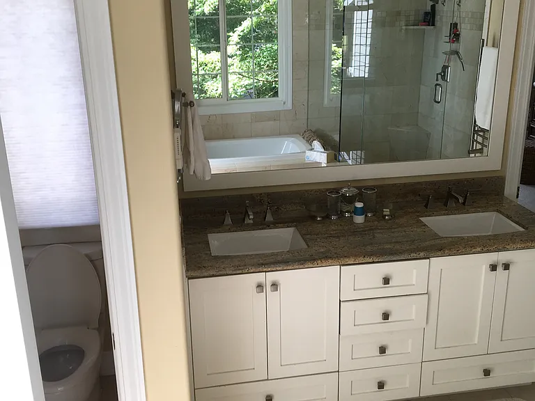 Double vanity, granite countertops, dimmable over the mirror lighting along with in ceiling recessed lighting. Separate water closet room.