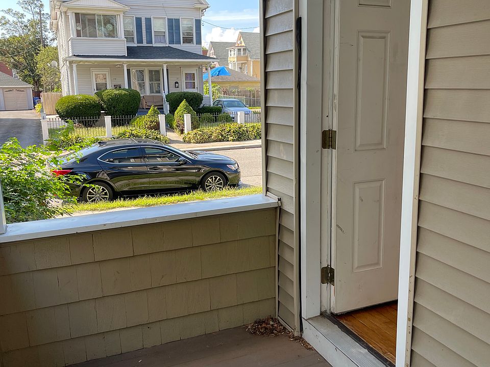 View from side balcony toward Hazel St, with entrance back into living room.