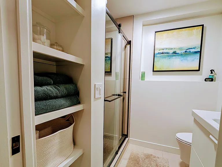 Primary bedroom - ensuite bathroom with walk-in shower and plenty of storage.