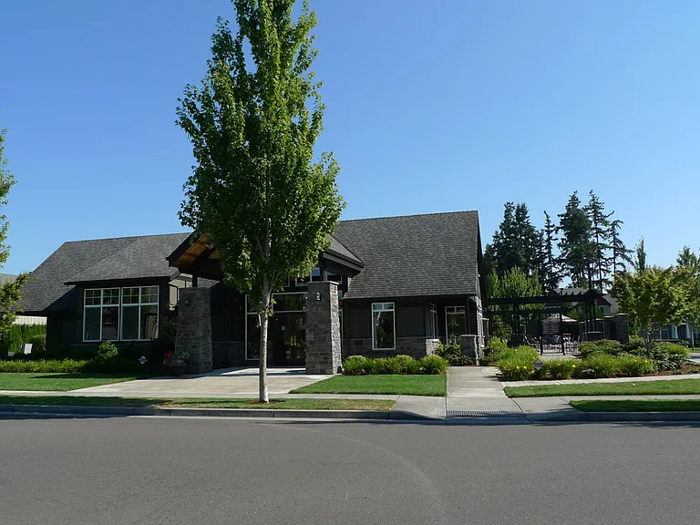 Club house of the townhouse community with inground heated pools and a small gym