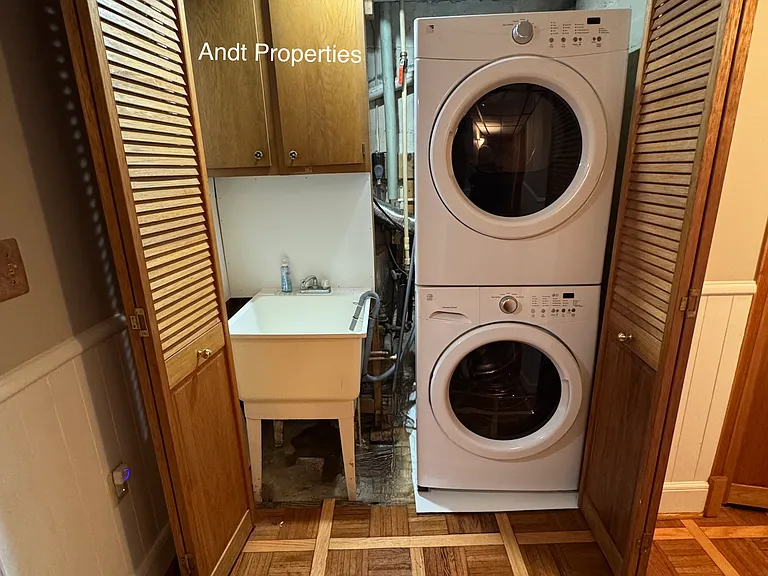 washer/dryer and laundry sink in lower level