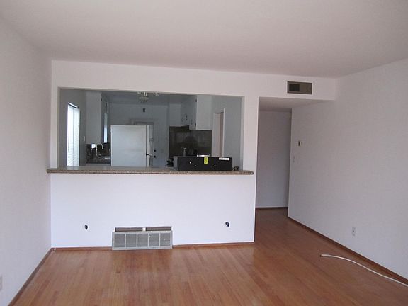 Living room ,showing breakfast nook.With kitchen in background.