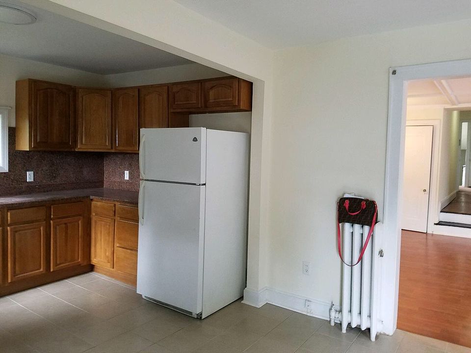 Refridgerator and large space for breakfast nook