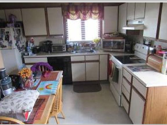 Kitchen with lots of cabinet space. Stove, fridge, and dishwasher included